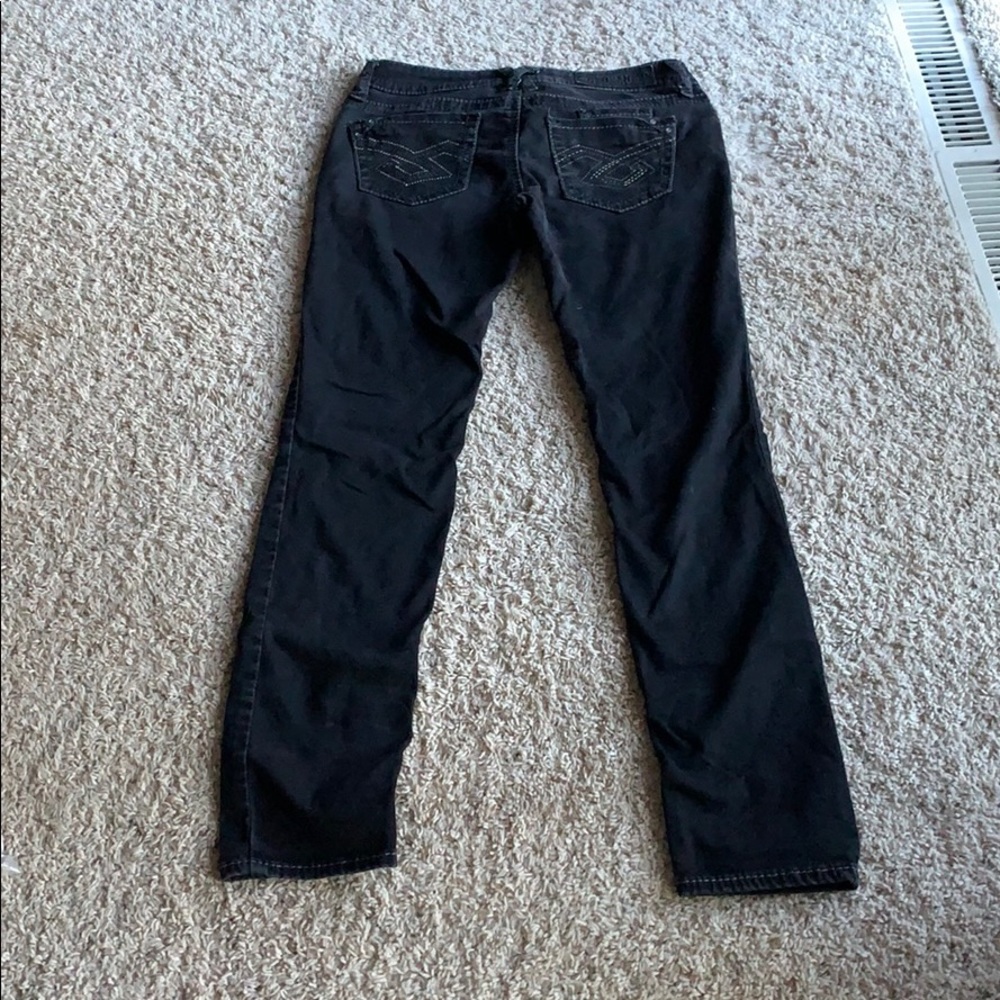 Black low rise, slim cut jeans